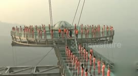 150 women do yoga on a 700-metre-high platform