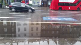 Bus lanes flooded in Clapham, London after major overnight storms