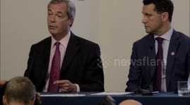 ukip Nigel Farage takes  question.at press conference .