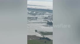 Swollen river floods homes after Typhoon Toraji batters the Philippines