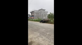 Rhino attacks motorcycle rider and chases him away in Nepal