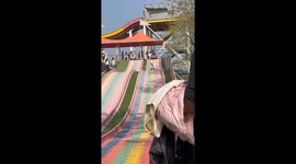 Lady falls on child while sliding at park in Henan province, China