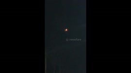 Colorful Flashing UFO Appears Stationary Over Wichita Neighborhood