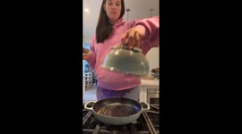 Exclusive- Woman's joy of baking in a bread oven