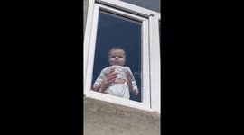 Serious Baby Stares Out Window