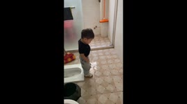 Child humorously tumbles into squat toilet in China