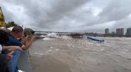 Wave from river splashes over camera during recording
