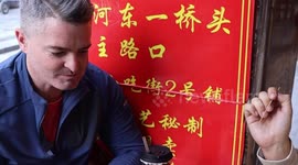 Foreign vloggers impressed by sour snack in China's Guangxi