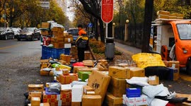 China: A Courier handles the distribution of express goods at the gate of a community in Beijing