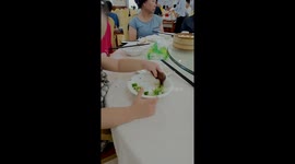 Toddler uses chicken’s head to pick up broccoli from plate