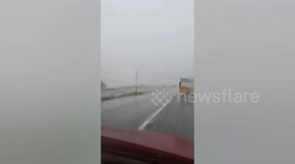 Heavy rain batters highway as Typhoon Usagi nears the Philippines