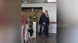 Father makes his way down aisle - but forgets the bride