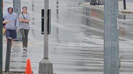 People Navigating Rain Lexington