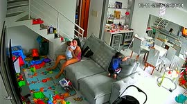 Rambunctious Boy Tumbles Over Couch Cushion