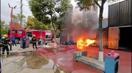 Chinese firefighters use water shield to combat blaze