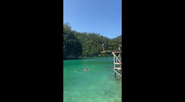 Tourist has epic diving fail from plank into lake