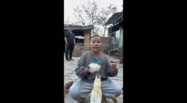 Boy falls after chicken steals food from his chopsticks