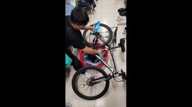 Cyclist uses his bike pedals to do laundry