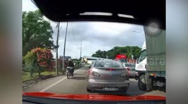 Woman crushed to death by overturned shipping container