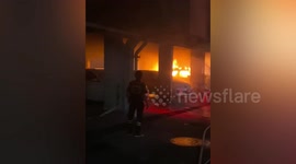 Three cars catch fire in apartment block car park in Bangkok