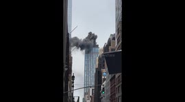 Fire breaks out on Midtown Manhattan skyscraper roof, smoke billows into air
