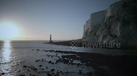 Seals and seal pups basking and playing on the rocks near Beachy Head, East Sussex, UK