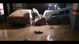 Spain: Emergency Crews Battle Mudslides, Rescue Vehicles from Garages in Sedaví
