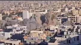 Lebanon: Israeli warplanes flatten to the ground a residential building near the Saint George Hospital in the southern district of Beirut