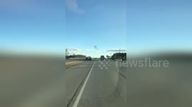 Beautiful bird murmuration seen over highway in Georgia