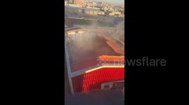 Roof of ice rink collapses in China sending up clouds of dust