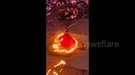 Chinese fire dancer forced to halt performance as flames ignite her skirt
