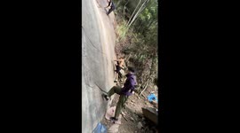 Climber appears to defy gravity by walking up vertical rock face