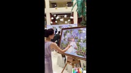 Wedding painter makes oil painting of bride and groom