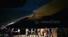 Soldiers load military plane with relief goods as Tropical Storm Man-yi leaves the Philippines