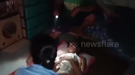Policewoman helps housewife give birth amid Super Typhoon Man-yi in the Philippines