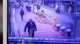 Quick-thinking security guard sprints to save elderly man from backward fall in China