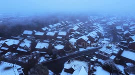 Drone footage shows snow-covered roofs of houses in Hertfordshire as temperatures plummet across UK