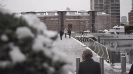 Commuters brave the slippery severe snowfall in the capital