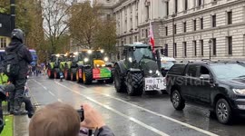Tractors pass through Westminster as thousands.  of farmers stage a protest against inheritance tax
