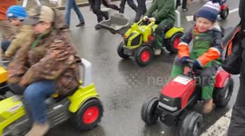 Kids drive toy tractors outside the Parliament in London as farmers stage massive protest against inheritance tax