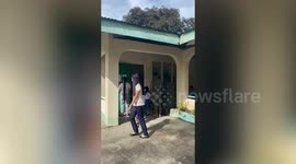 Tearful boy dawdles at the back of line on first day at school