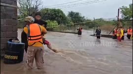Rescue teams save children trapped in river during Tropical Storm Sara