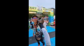 Man completes 10km race in Malaysia with cat on shoulder