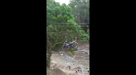 Locals use zip line to carry motorcycle across river after bridge breaks