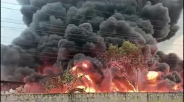 Firemen battle blaze at plastic pipe factory in India