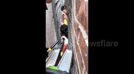 Young girl trapped in 10cm wall gap rescued by firefighters in China