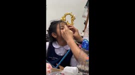 Schoolgirl has wobbly tooth removed the old-fashioned way