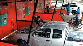 Motorcycle rider crashes into car wash building
