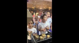 Children cheer for Messi-themed candy in San Isidro, Argentina