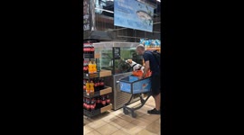 Dog licks fish tank at Kyiv store